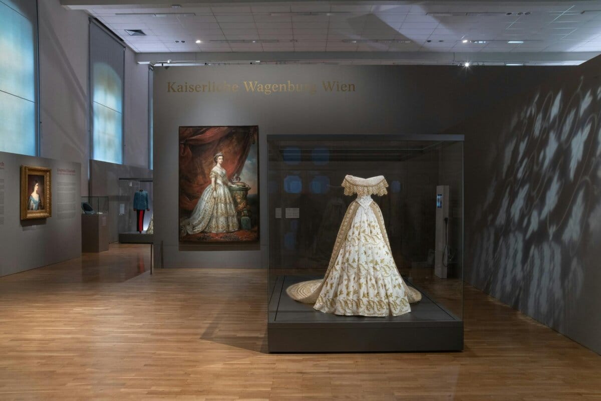Imperial dress and portrait in Vienna museum display.