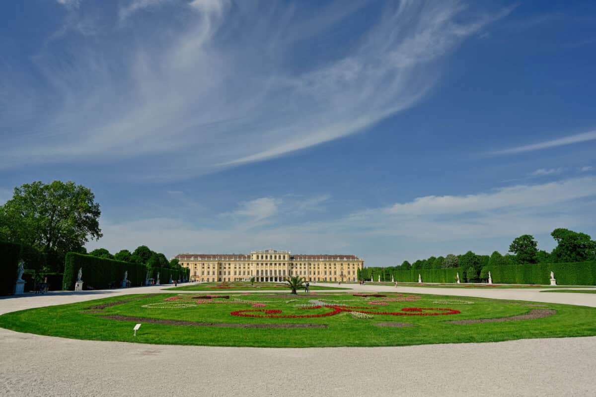 Schönbrunn Palace gardens under clear blue sky